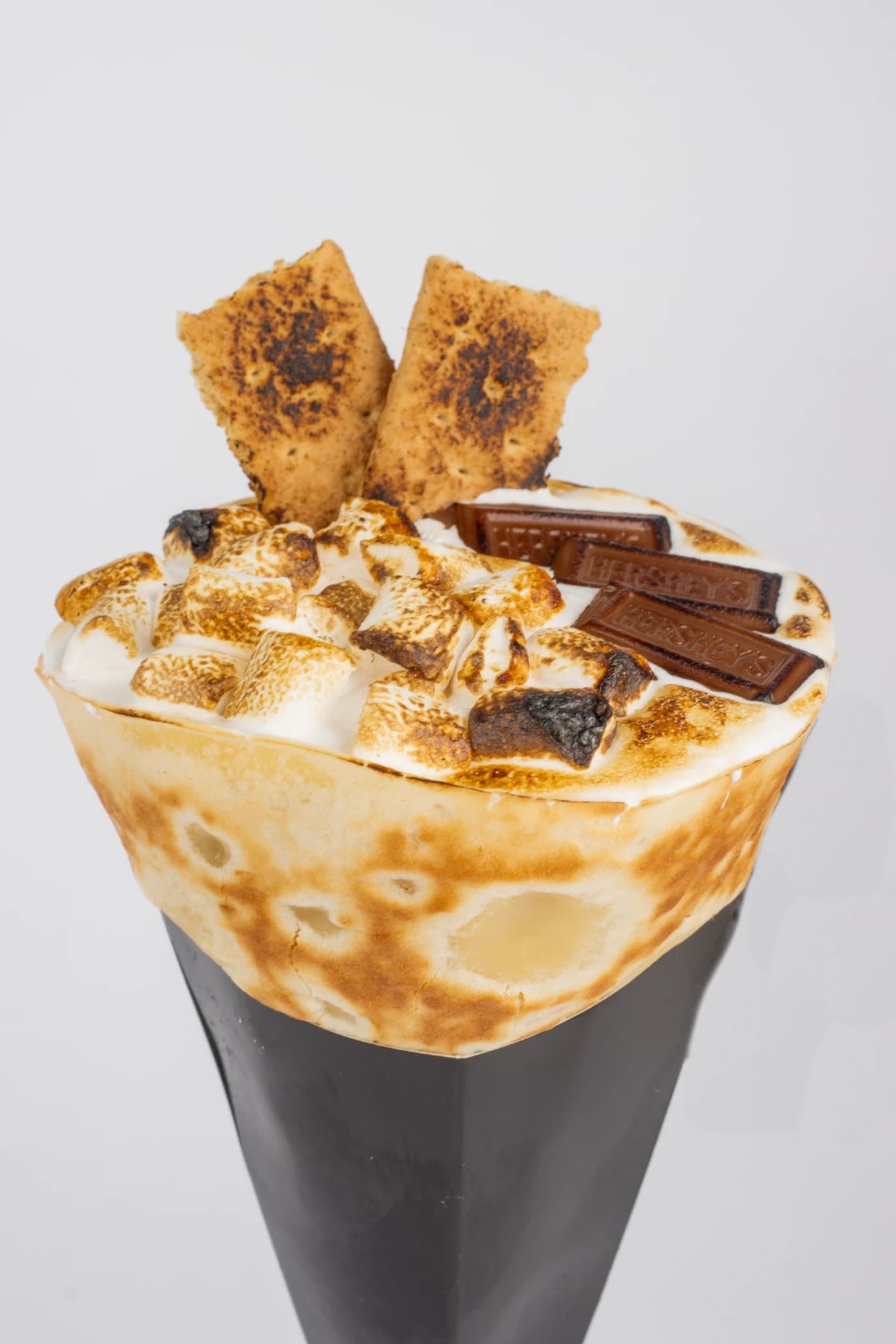 The S'More crepe cone with torched marshmallows, Hershey's chocolate and graham crackers.